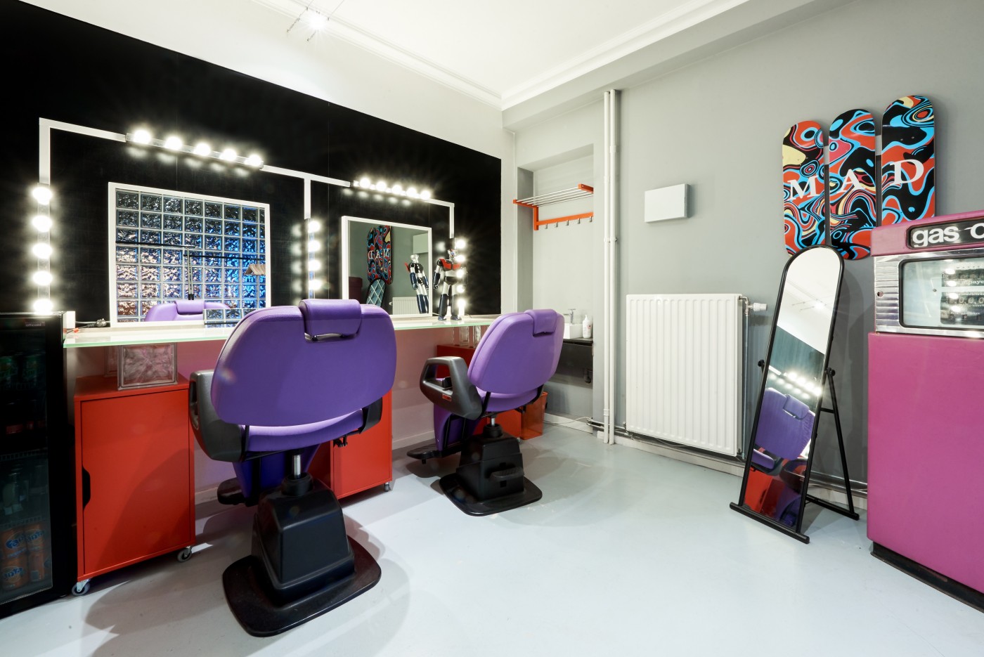 Make-up and styling room with two chairs and lit mirrors