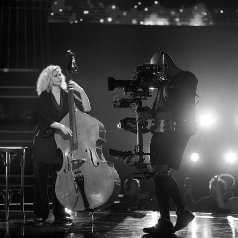 Steadicam operator filming a live music performance