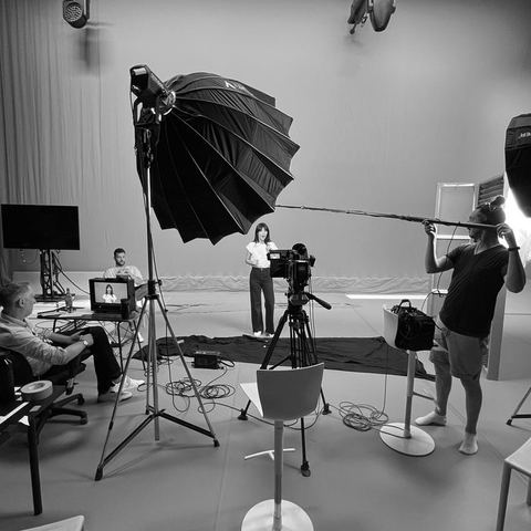 Green screen studio shoot with presenter and crew